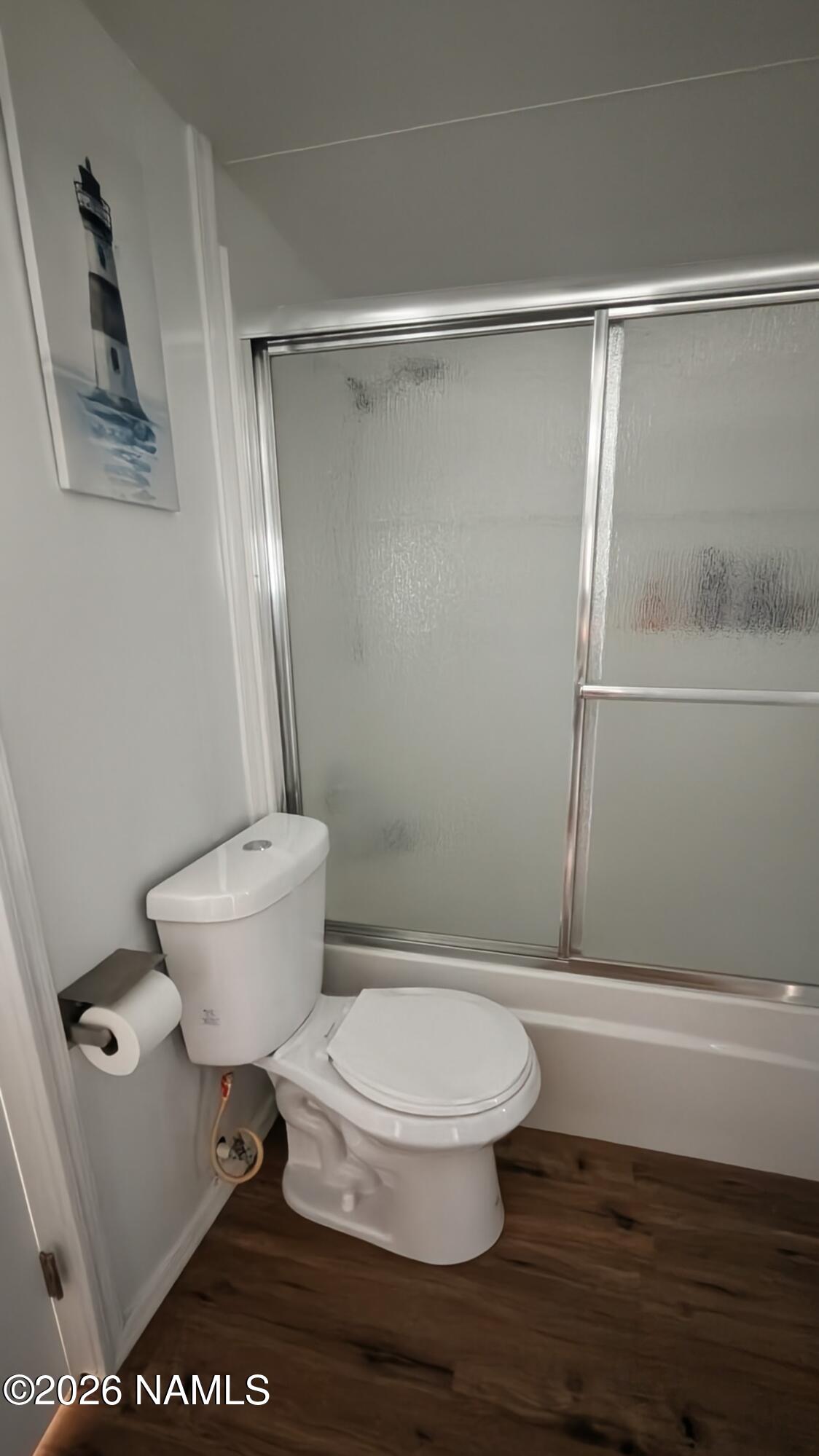 15702 Bonanza Loop Ehrenberg, AZ 85334 - Photo 7 of 13 a white toilet sitting next to a shower