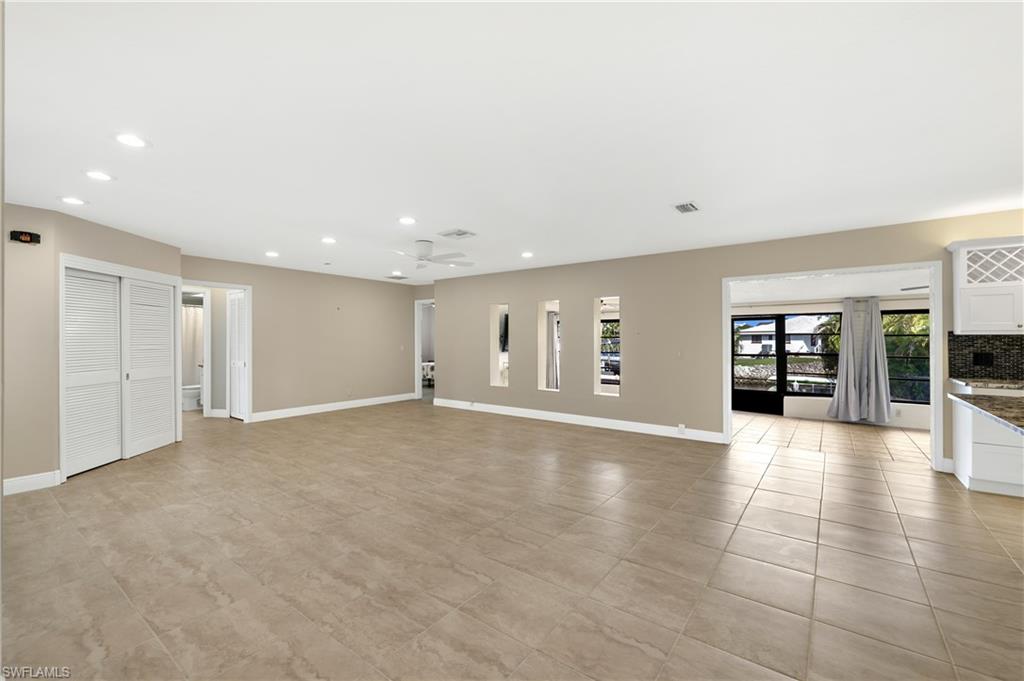 3461 Lakeview Drive Naples, FL 34112 - Photo 11 of 32 a view of an empty room with closet and a window