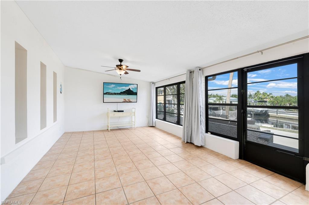 3461 Lakeview Drive Naples, FL 34112 - Photo 20 of 32 a view of an empty room with a window