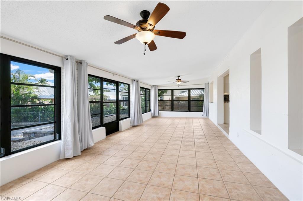 3461 Lakeview Drive Naples, FL 34112 - Photo 21 of 32 a view of an entryway with wooden floor
