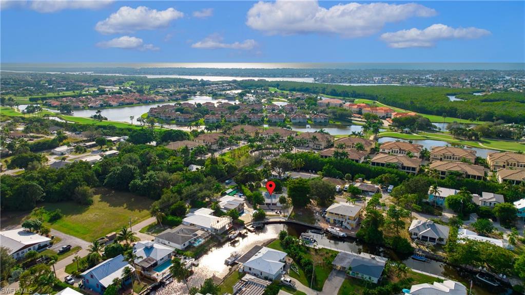 3461 Lakeview Drive Naples, FL 34112 - Photo 6 of 32 an aerial view of residential houses with outdoor space and river