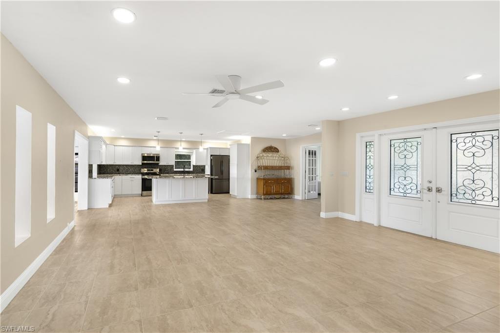 3461 Lakeview Drive Naples, FL 34112 - Photo 7 of 32 a view of a kitchen with furniture and a kitchen
