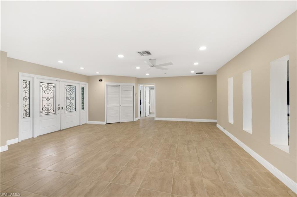 3461 Lakeview Drive Naples, FL 34112 - Photo 10 of 32 a view of an empty room with a window