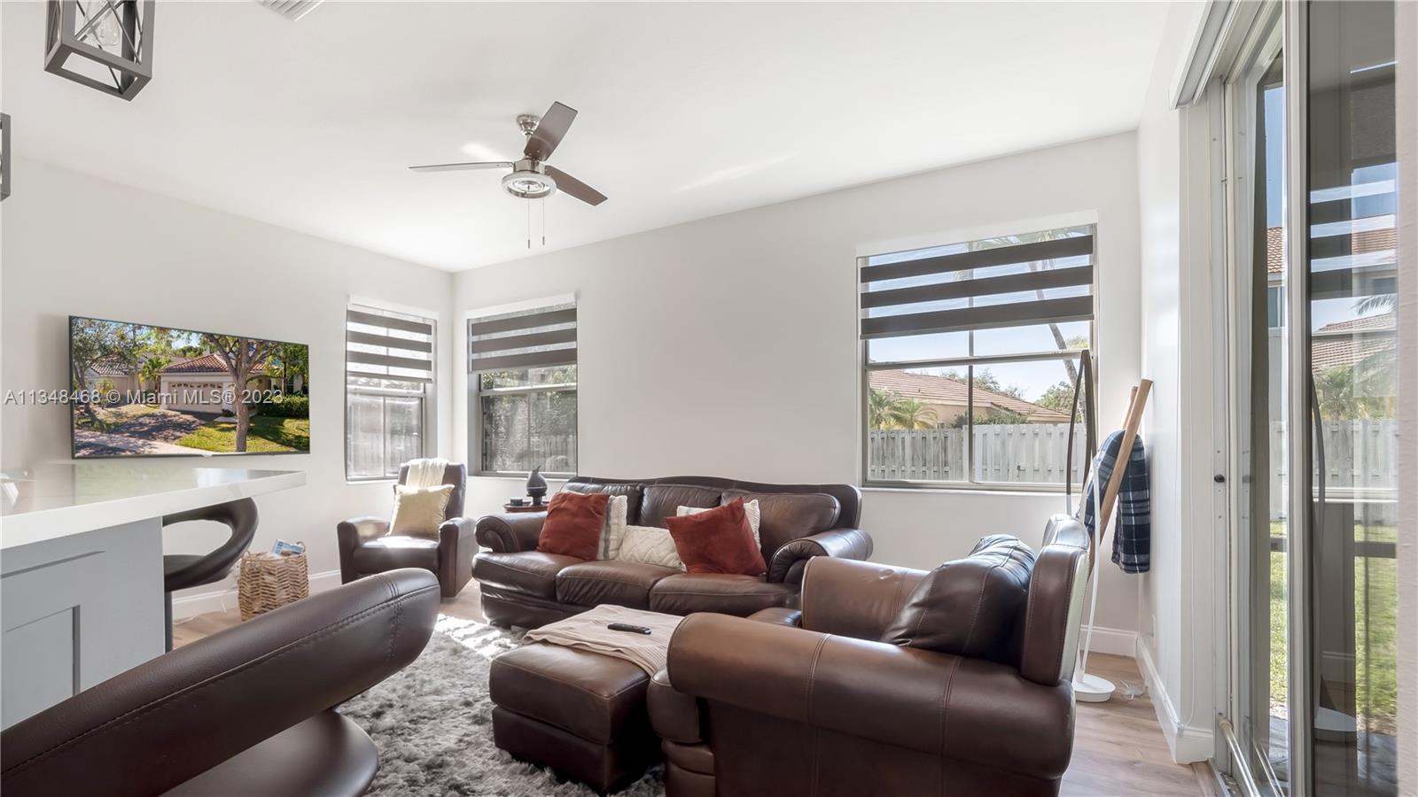 675 Falling Water Road Weston, FL 33326 - Photo 14 of 39 a living room with furniture and a large window
