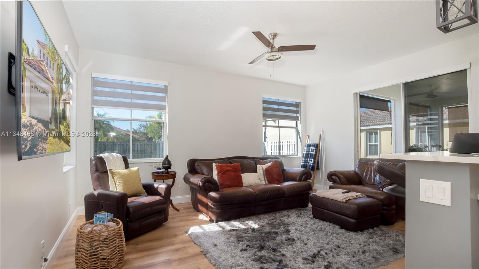 675 Falling Water Road Weston, FL 33326 - Photo 15 of 39 a living room with furniture and a window