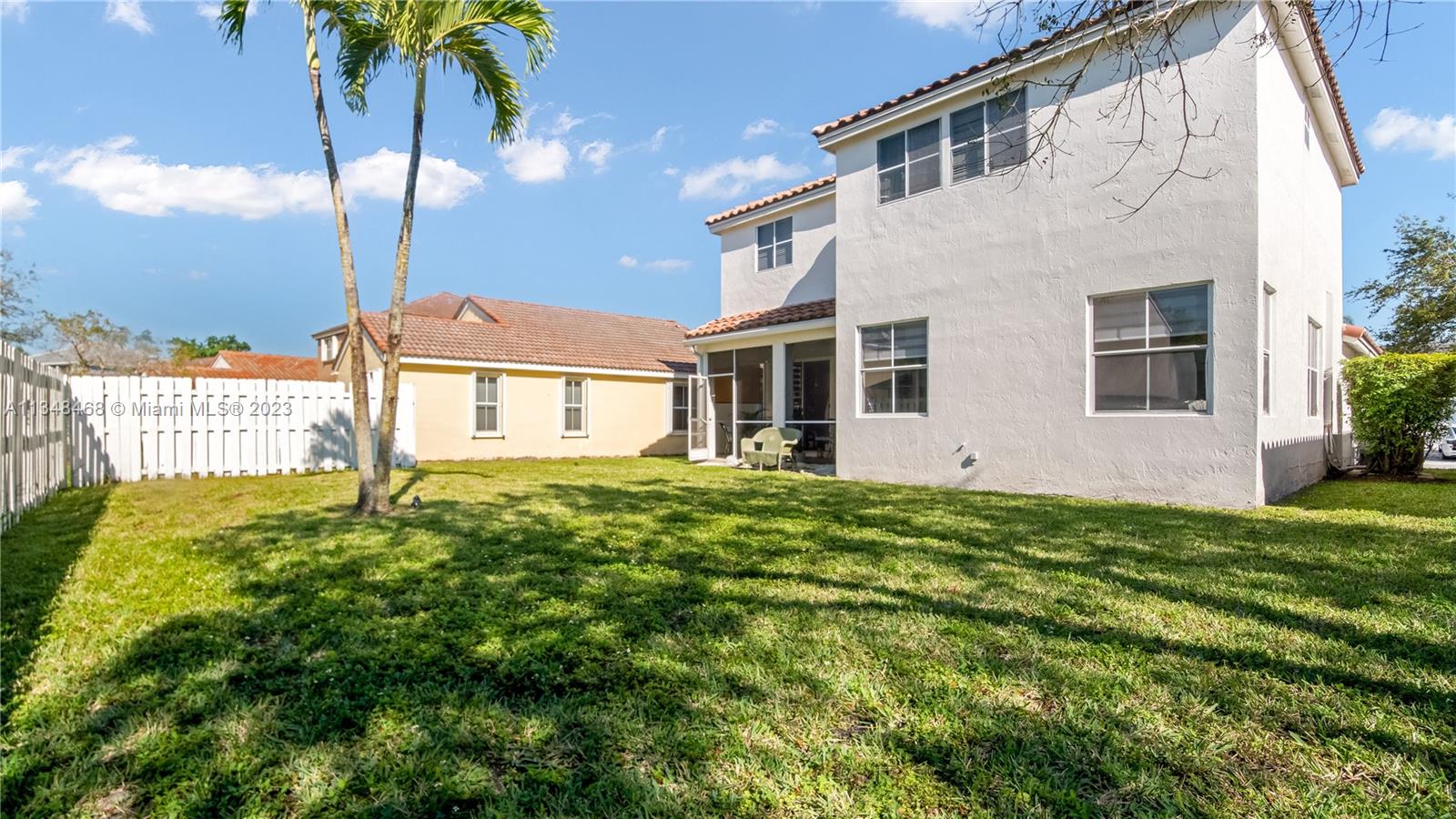 675 Falling Water Road Weston, FL 33326 - Photo 26 of 39 a view of a house with a yard
