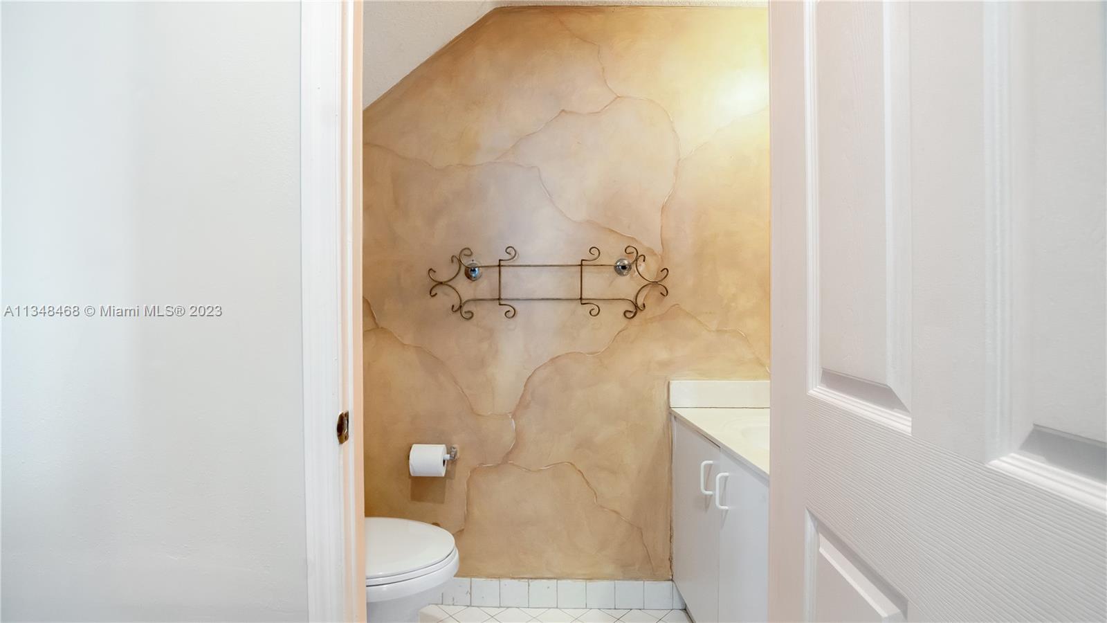 675 Falling Water Road Weston, FL 33326 - Photo 28 of 39 a bathroom with a granite countertop shower and a toilet