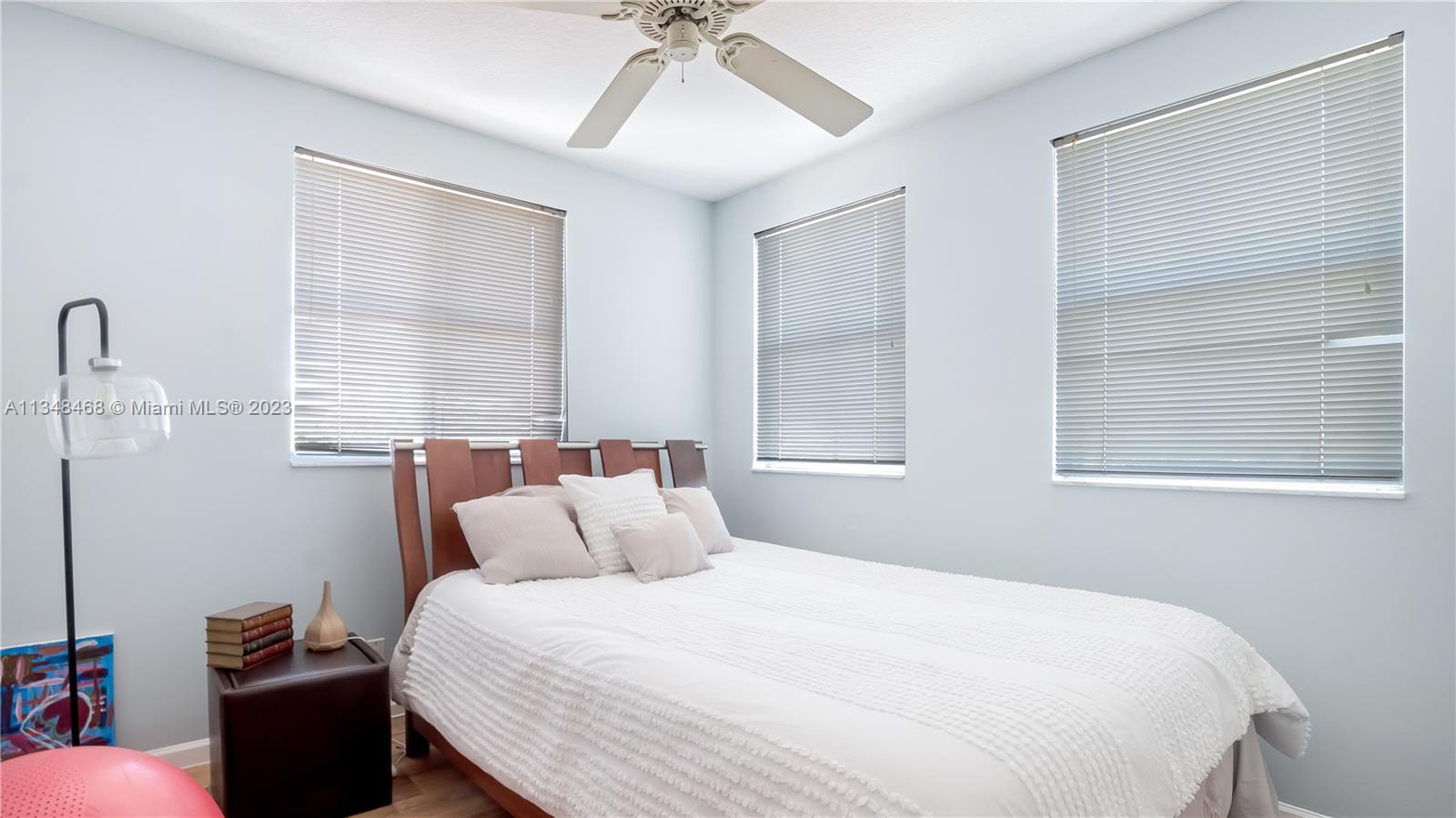 675 Falling Water Road Weston, FL 33326 - Photo 29 of 39 a bedroom with a bed and a window