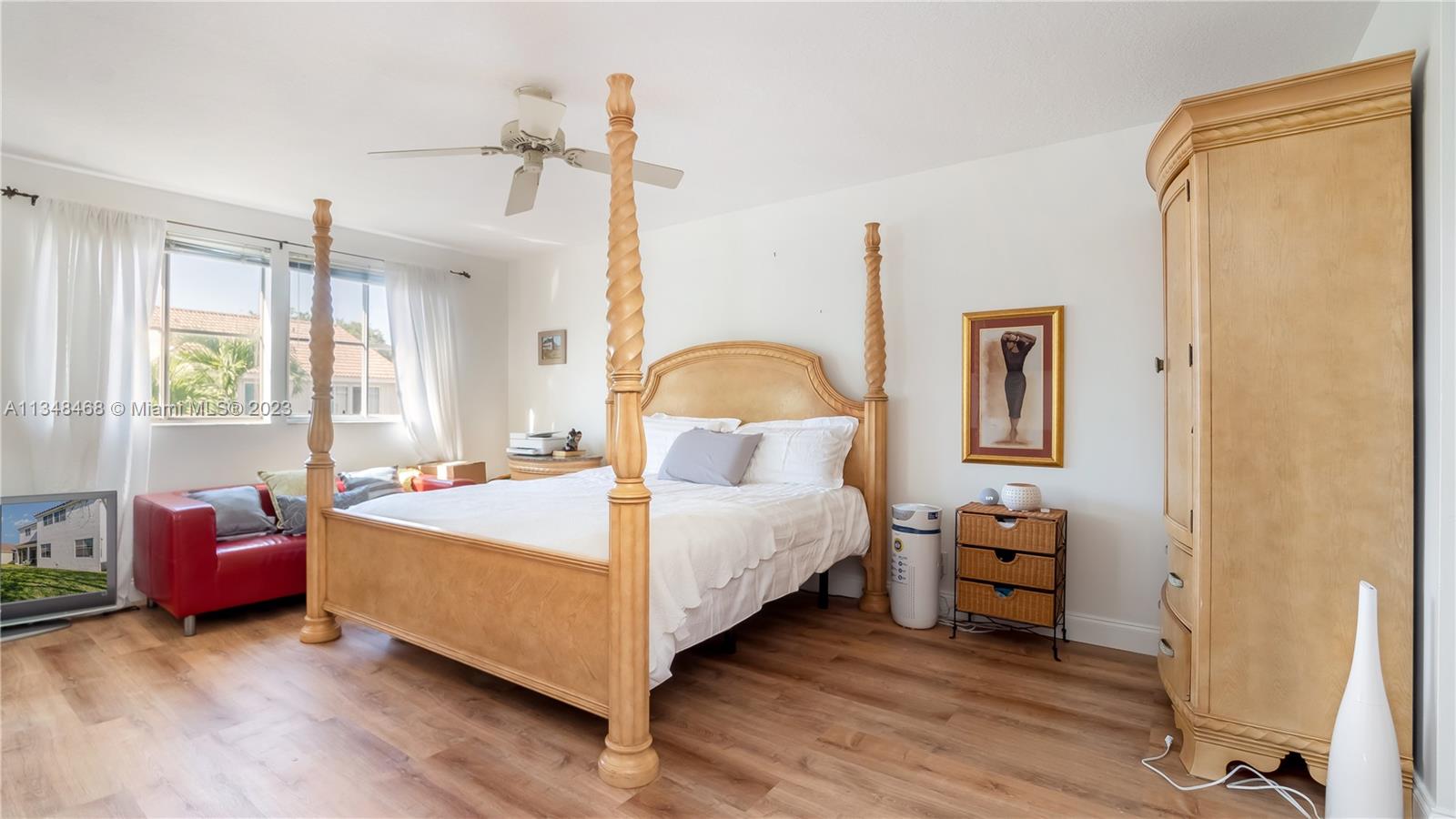 675 Falling Water Road Weston, FL 33326 - Photo 38 of 39 a bedroom with a bed and a window