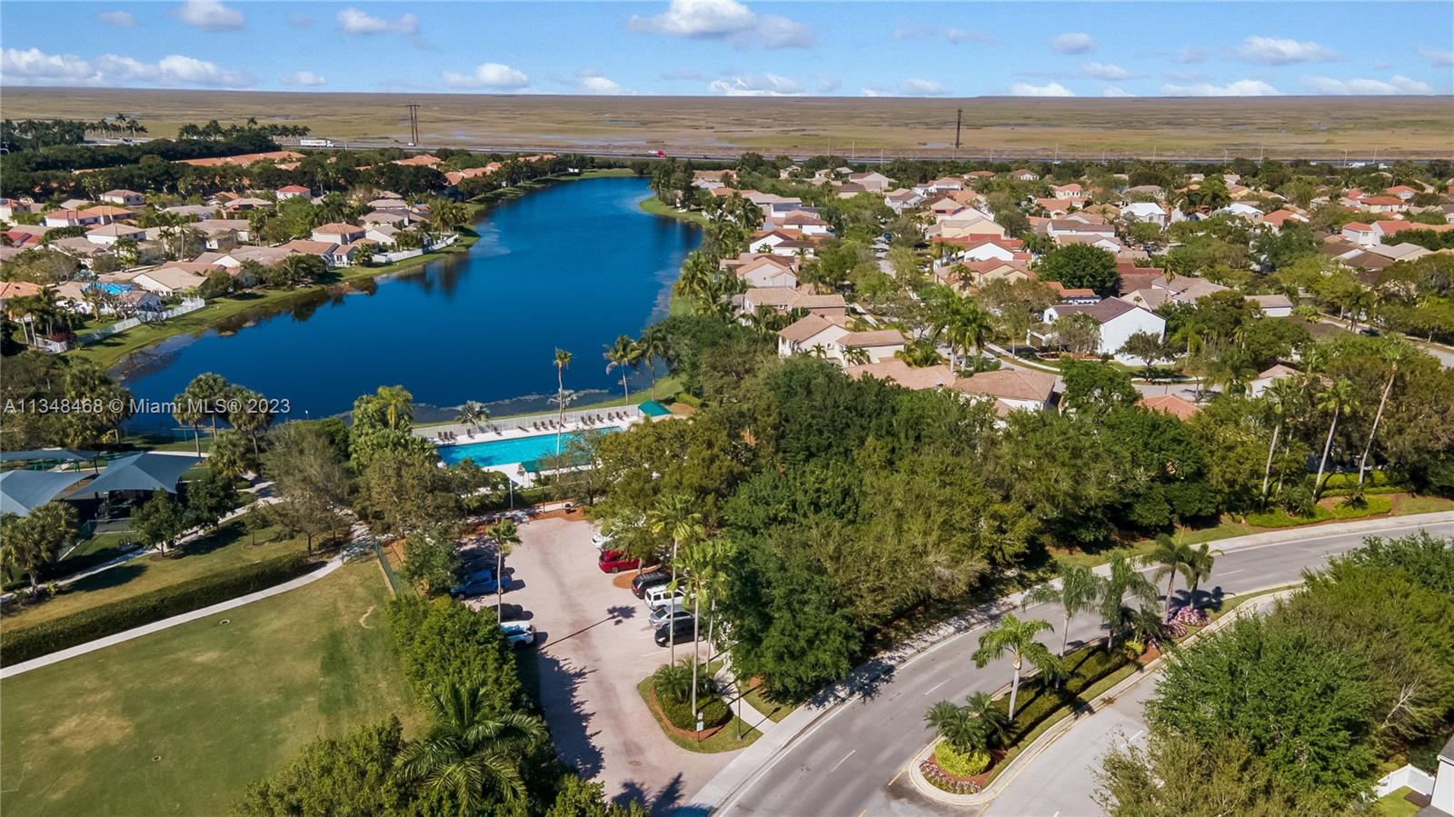 675 Falling Water Road Weston, FL 33326 - Photo 7 of 39 an aerial view of residential houses with outdoor space