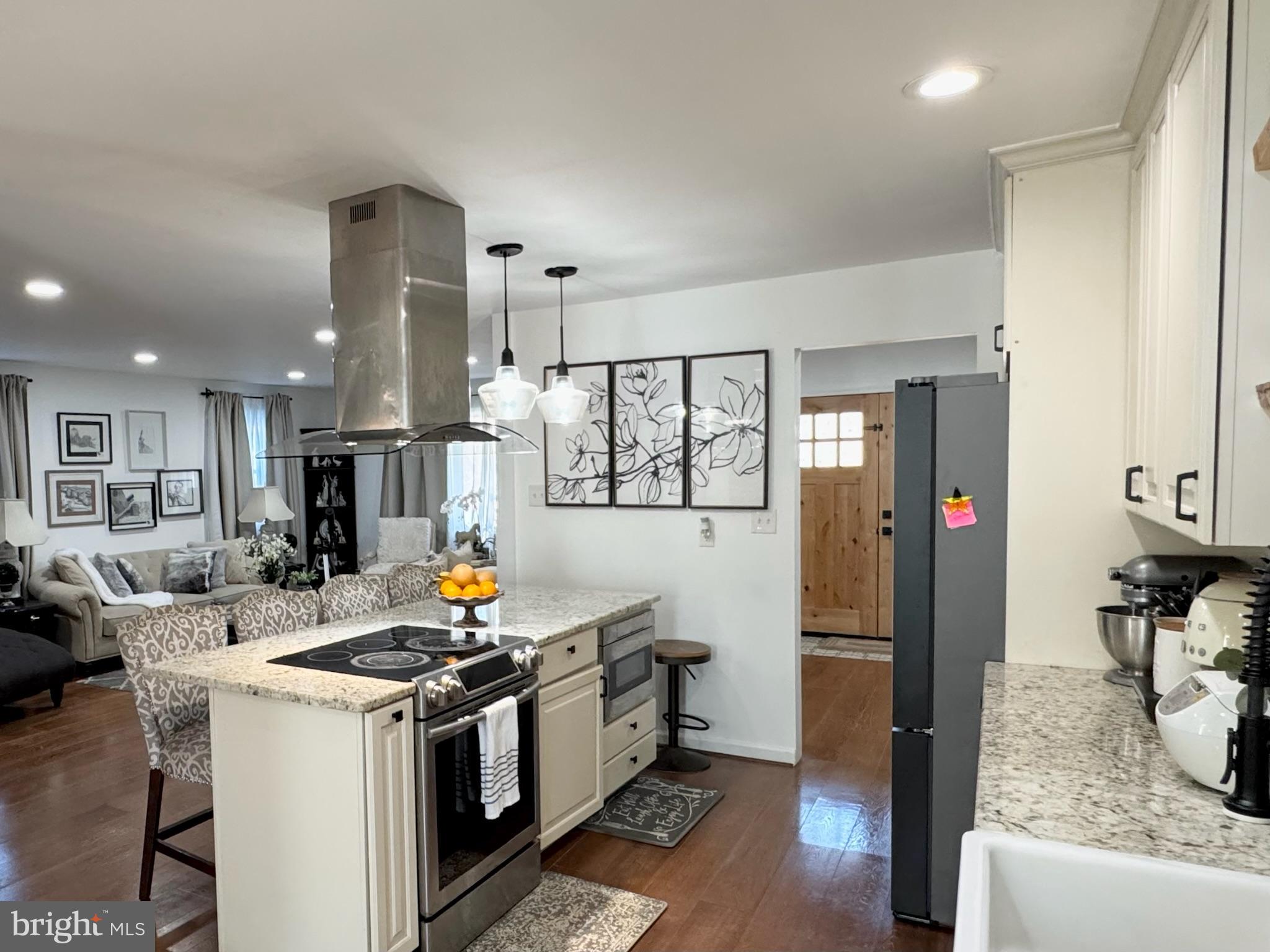 7397 New Cut Road Kingsville, MD 21087 - Photo 14 of 42 a kitchen with stainless steel appliances granite countertop a stove and a refrigerator