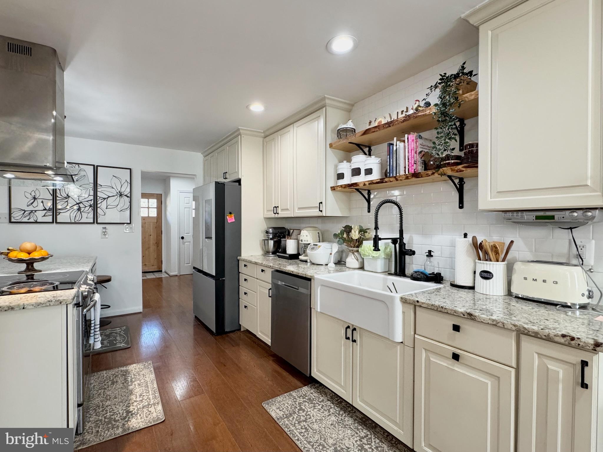 7397 New Cut Road Kingsville, MD 21087 - Photo 15 of 42 a kitchen with granite countertop a sink stainless steel appliances and cabinets