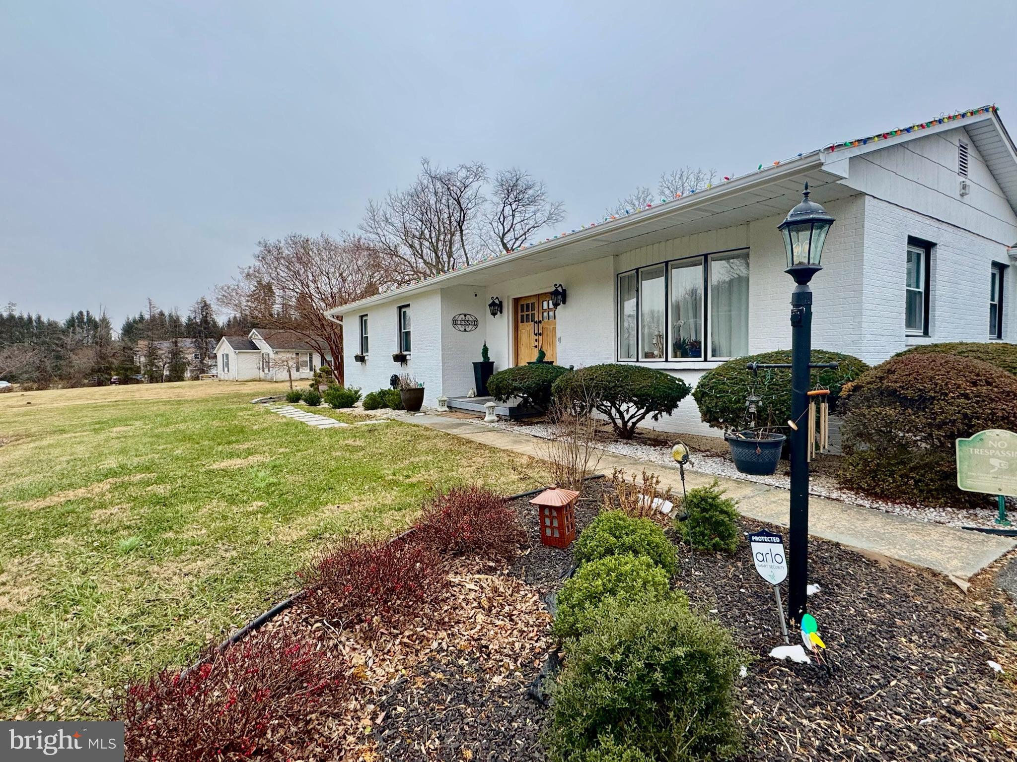 7397 New Cut Road Kingsville, MD 21087 - Photo 2 of 42 a front view of house with yard and outdoor seating
