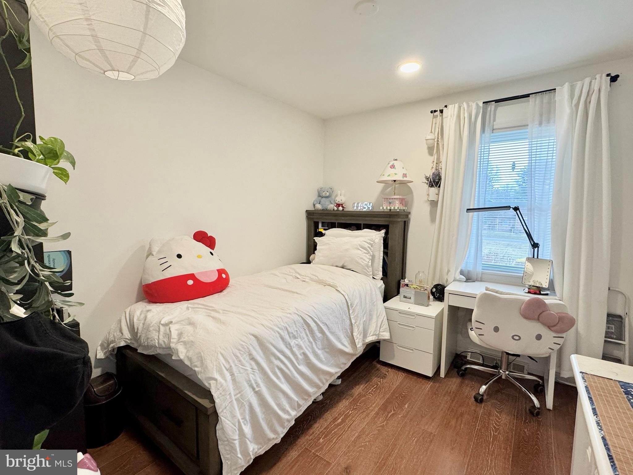 7397 New Cut Road Kingsville, MD 21087 - Photo 24 of 42 a bedroom with a bed and a chandelier