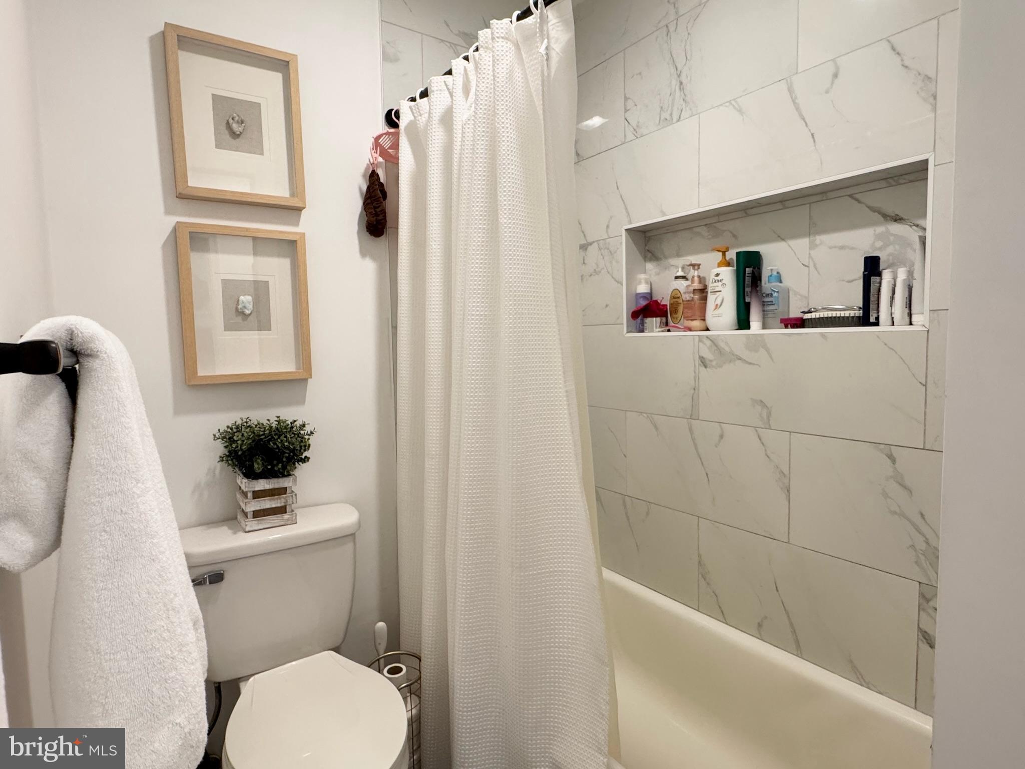 7397 New Cut Road Kingsville, MD 21087 - Photo 26 of 42 a bathroom with a toilet a sink and shower