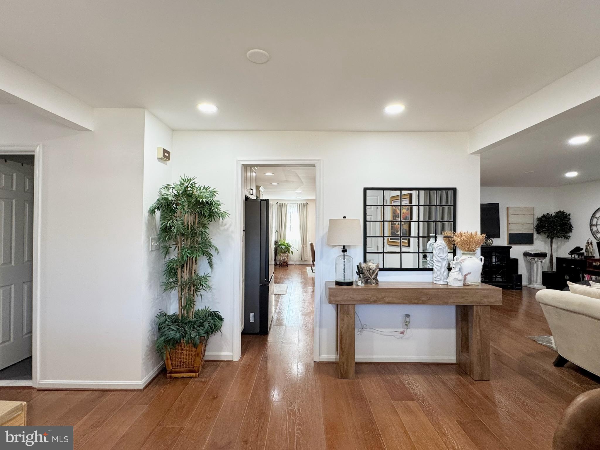 7397 New Cut Road Kingsville, MD 21087 - Photo 9 of 42 a very nice looking living room with kitchen and a chandelier