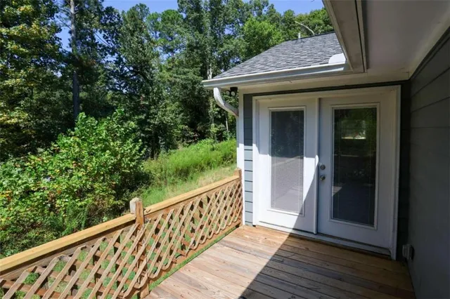 a view of a wooden door and a window
