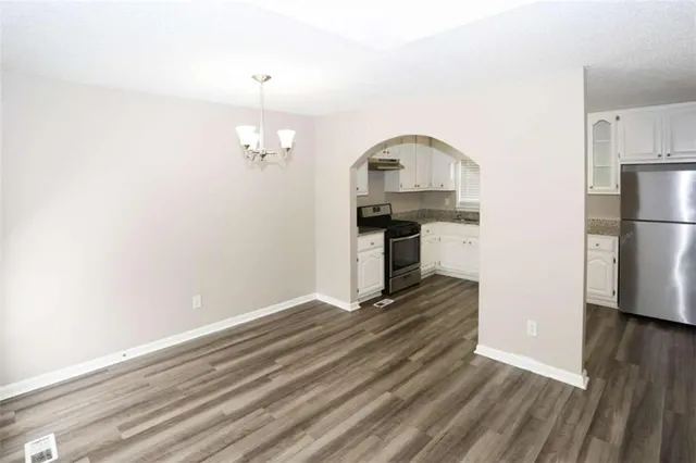 a view of a livingroom with wooden floor