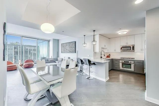 a kitchen with cabinets and white appliances