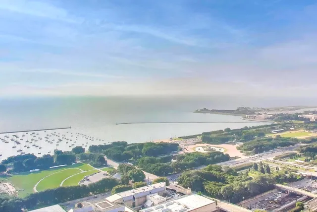 a bathroom with a bath tub with a shower