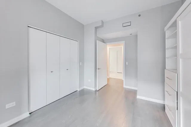 a dining room with furniture a chandelier and a floor to ceiling window