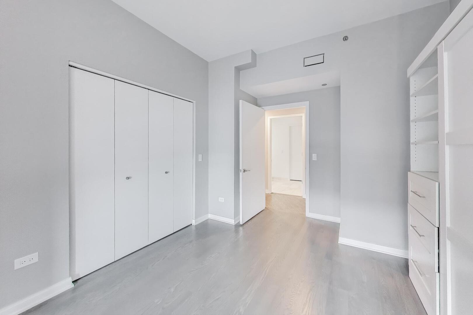 60 East Monroe Street, Unit 5103 Chicago, IL 60603 - Photo 29 of 63 a view of a room with wooden floor