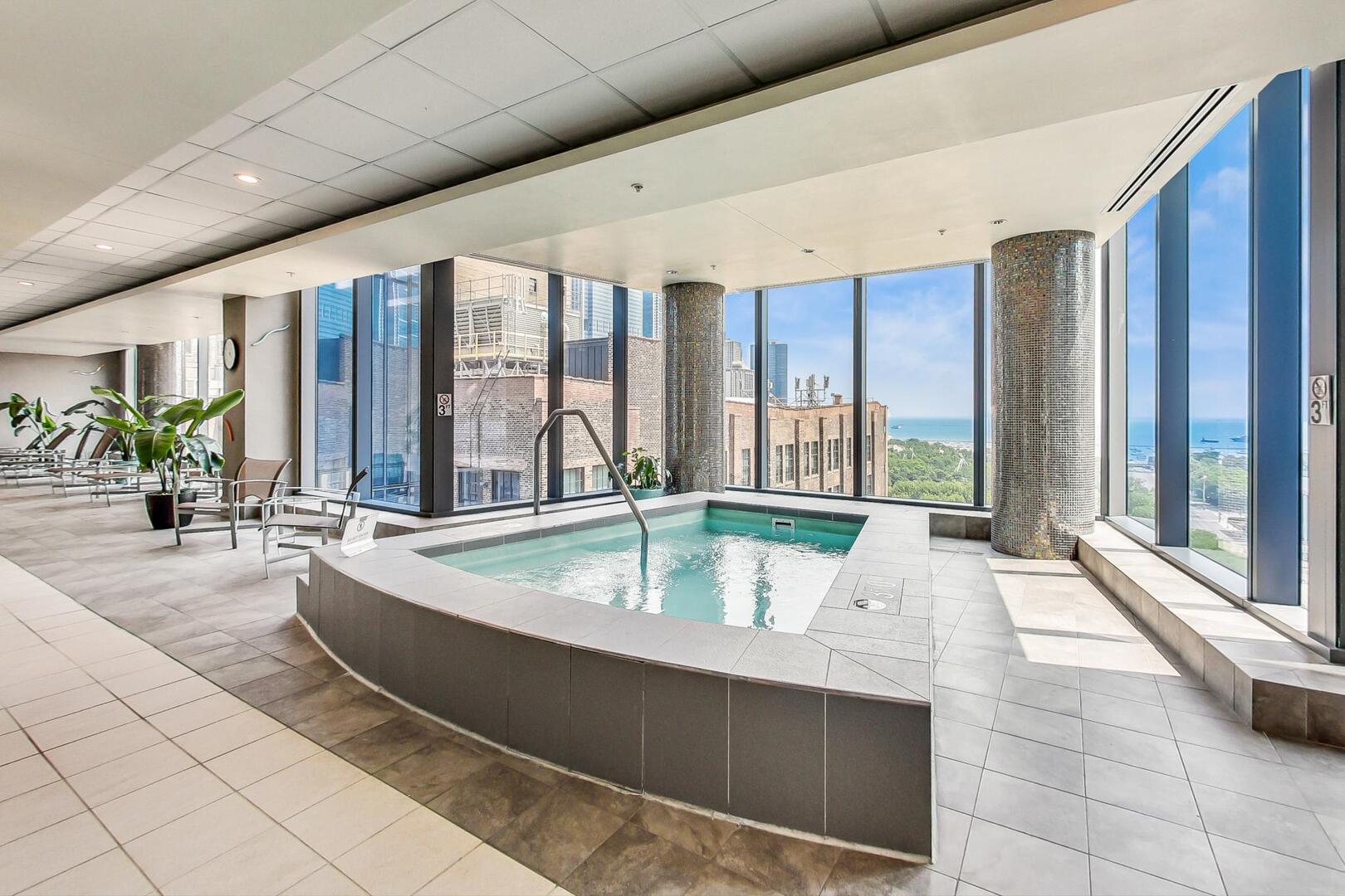 60 East Monroe Street, Unit 5103 Chicago, IL 60603 - Photo 47 of 63 a living room with furniture and large windows