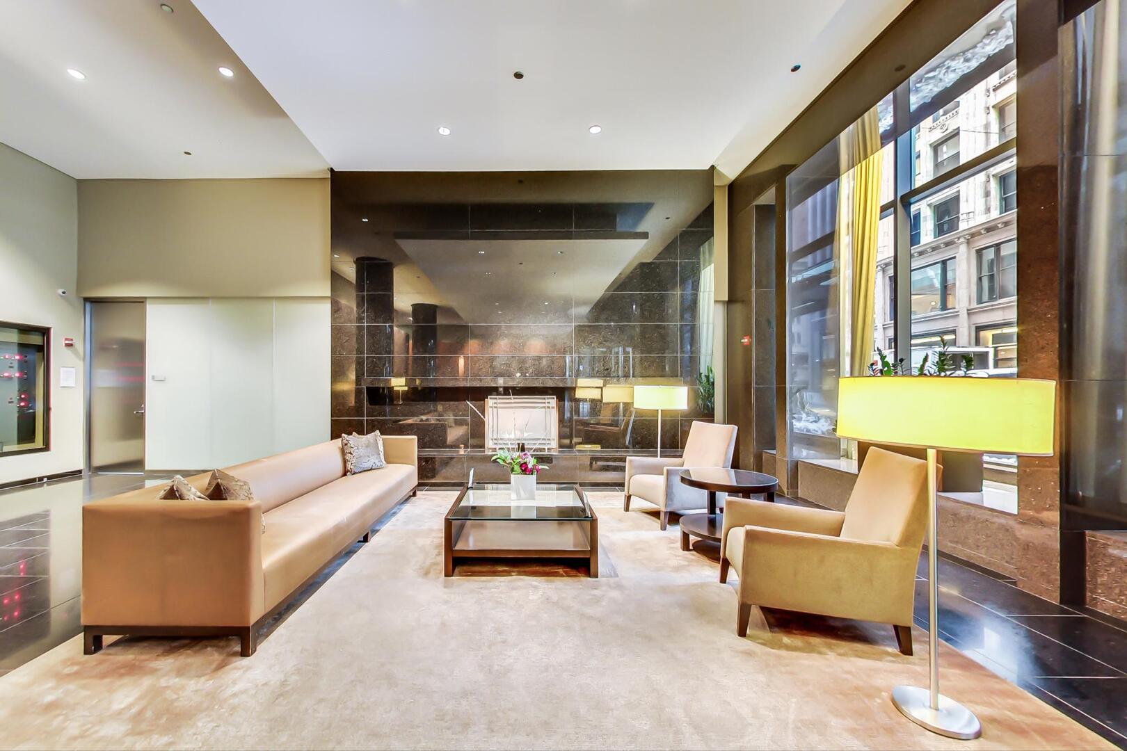 60 East Monroe Street, Unit 5103 Chicago, IL 60603 - Photo 5 of 63 a living room with furniture and a large window