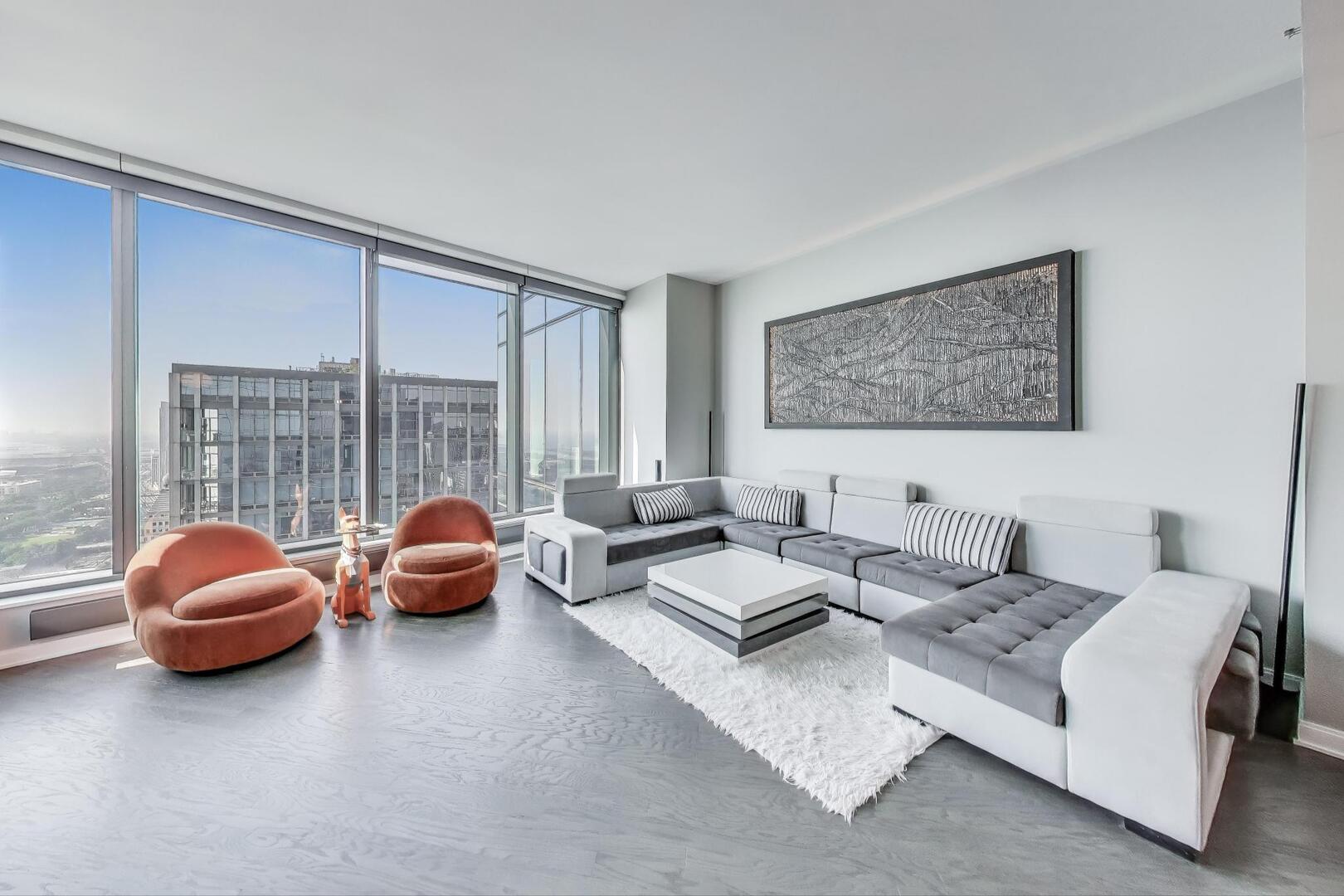 60 East Monroe Street, Unit 5103 Chicago, IL 60603 - Photo 6 of 63 a living room with furniture and a large window