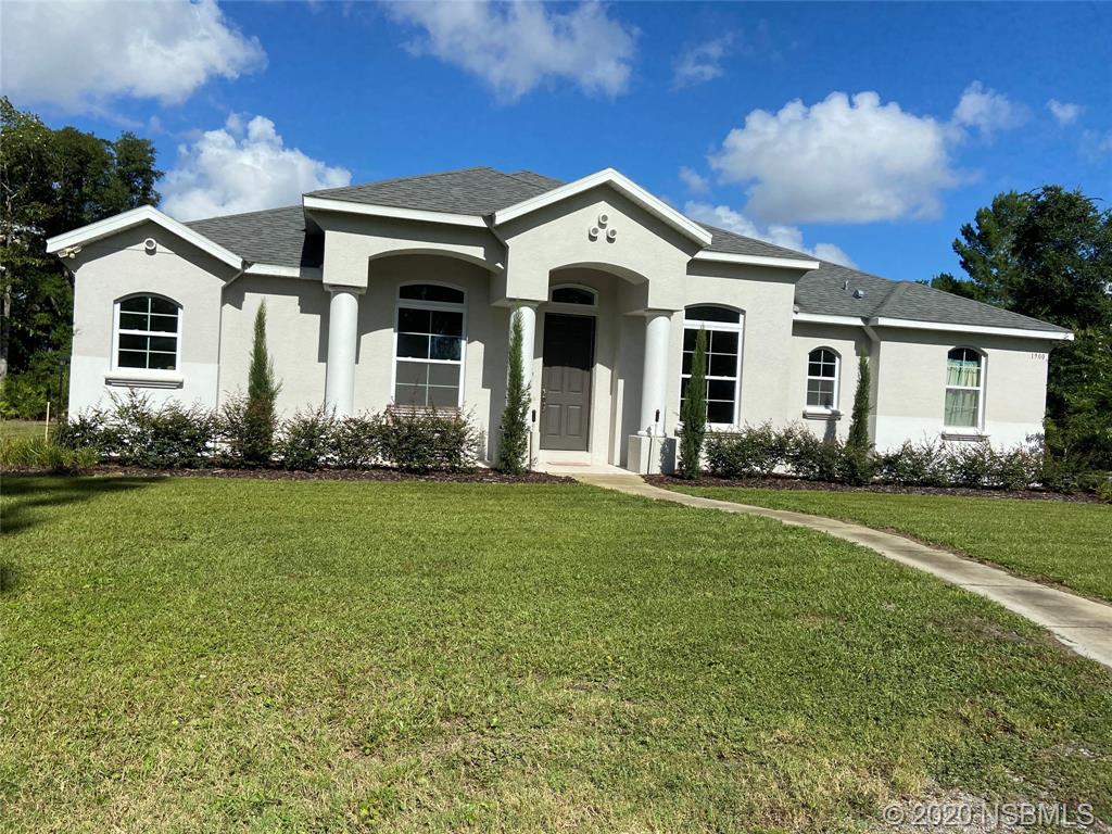 1900 Marsh Road DeLand, FL 32724 - Photo 1 of 39 a front view of a house with a yard