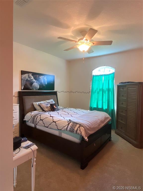 1900 Marsh Road DeLand, FL 32724 - Photo 19 of 39 a bedroom with a bed and a window