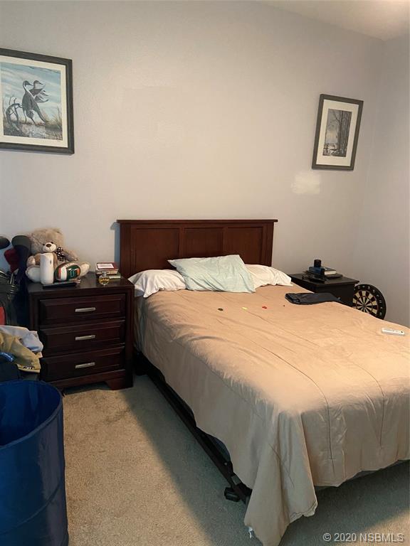 1900 Marsh Road DeLand, FL 32724 - Photo 23 of 39 a bedroom with a bed and wall painting