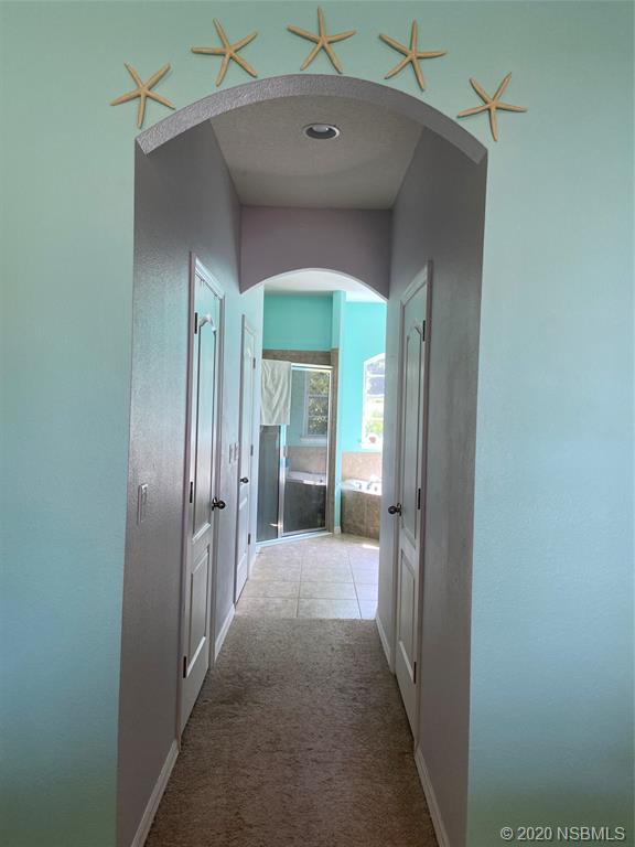1900 Marsh Road DeLand, FL 32724 - Photo 24 of 39 a view of a hallway with wooden shelves