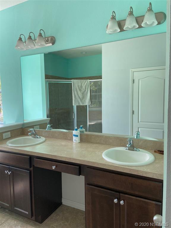 1900 Marsh Road DeLand, FL 32724 - Photo 26 of 39 a bathroom with a sink and a mirror