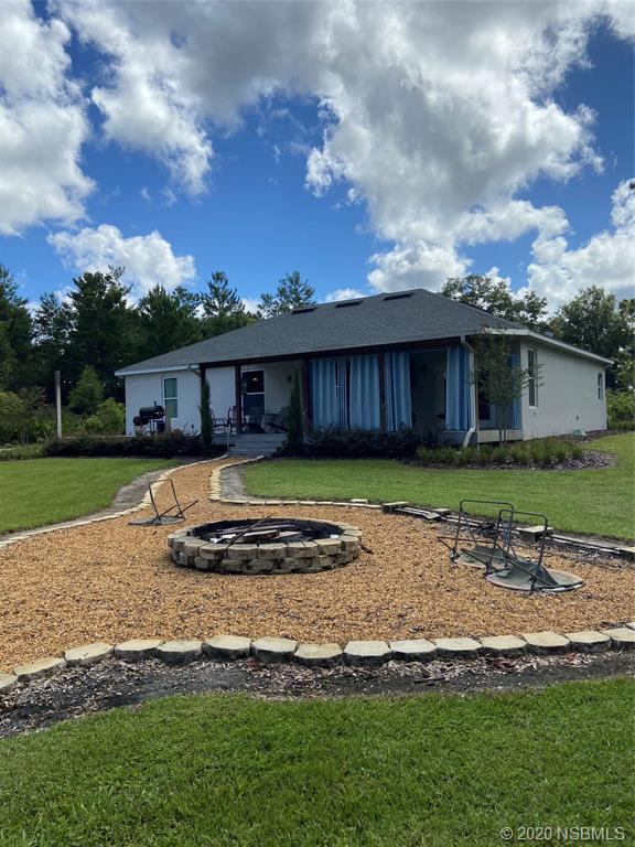 1900 Marsh Road DeLand, FL 32724 - Photo 4 of 39 a house with swimming pool in front of the house