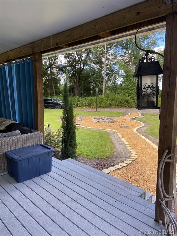 1900 Marsh Road DeLand, FL 32724 - Photo 32 of 39 a view of a room with wooden floor and outdoor view