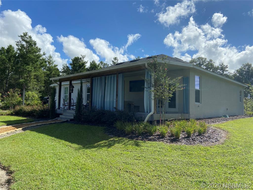 1900 Marsh Road DeLand, FL 32724 - Photo 5 of 39 a front view of a house with garden