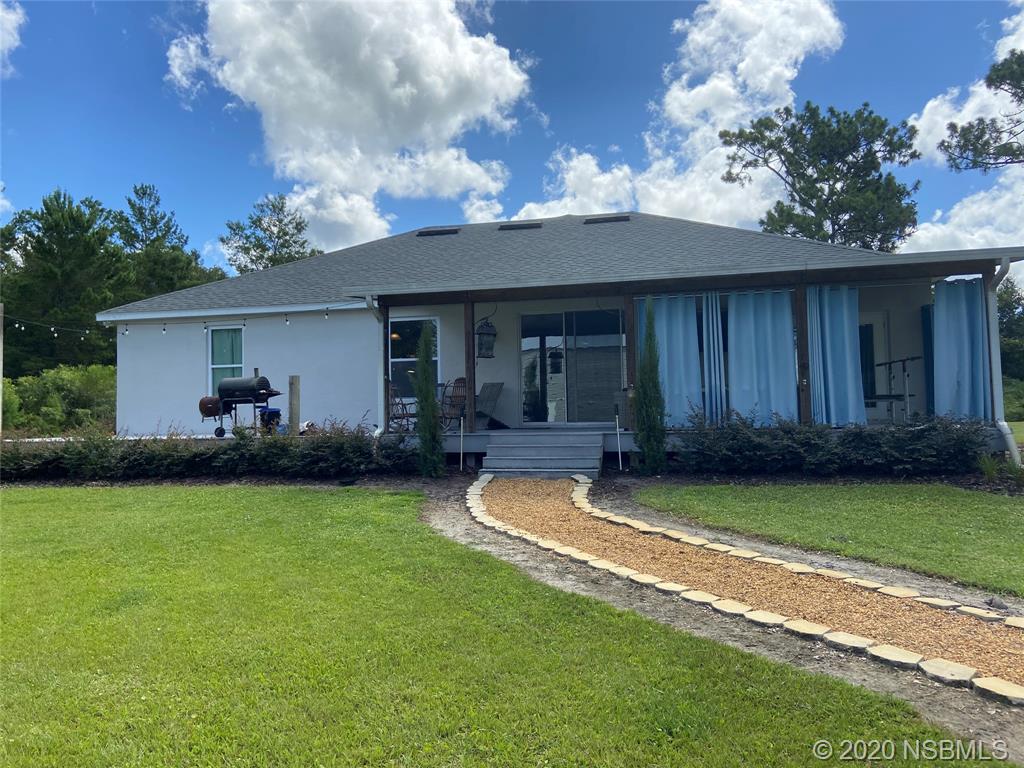 1900 Marsh Road DeLand, FL 32724 - Photo 6 of 39 a view of a house with backyard porch and furniture
