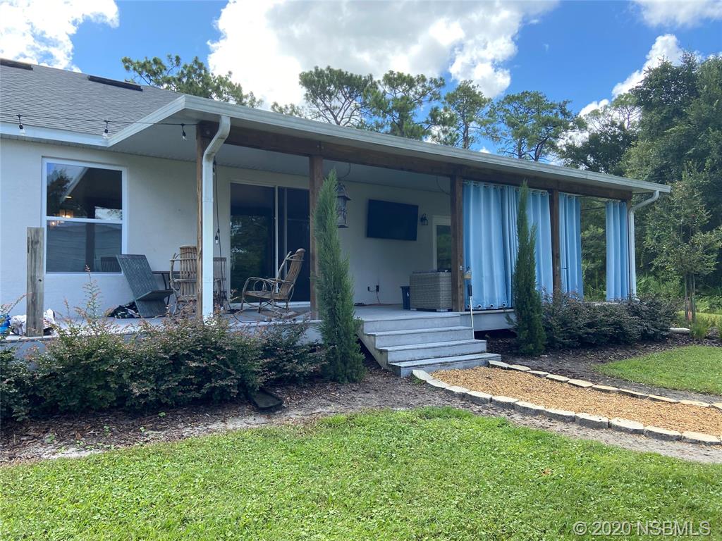 1900 Marsh Road DeLand, FL 32724 - Photo 7 of 39 a front view of a house with garden