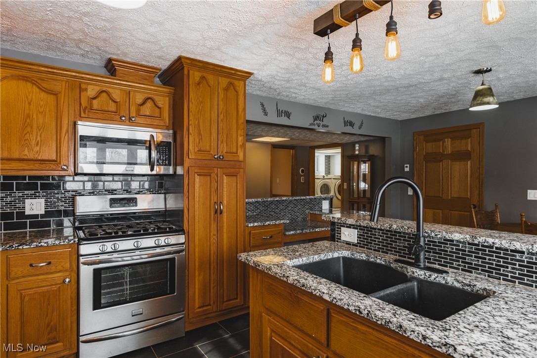 111 River Hill Road Washington, WV 26181 - Photo 5 of 29 Just look at that Granite countertop. Beautiful, right? All newer stainless steel appliances as well.