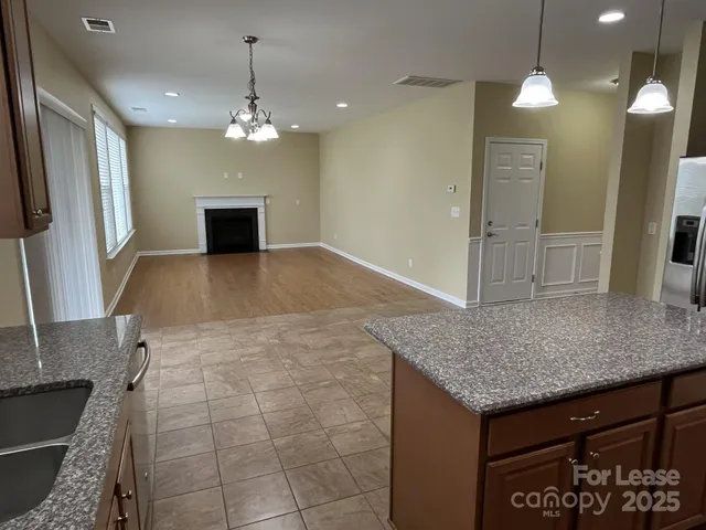 a view of an empty room with windows