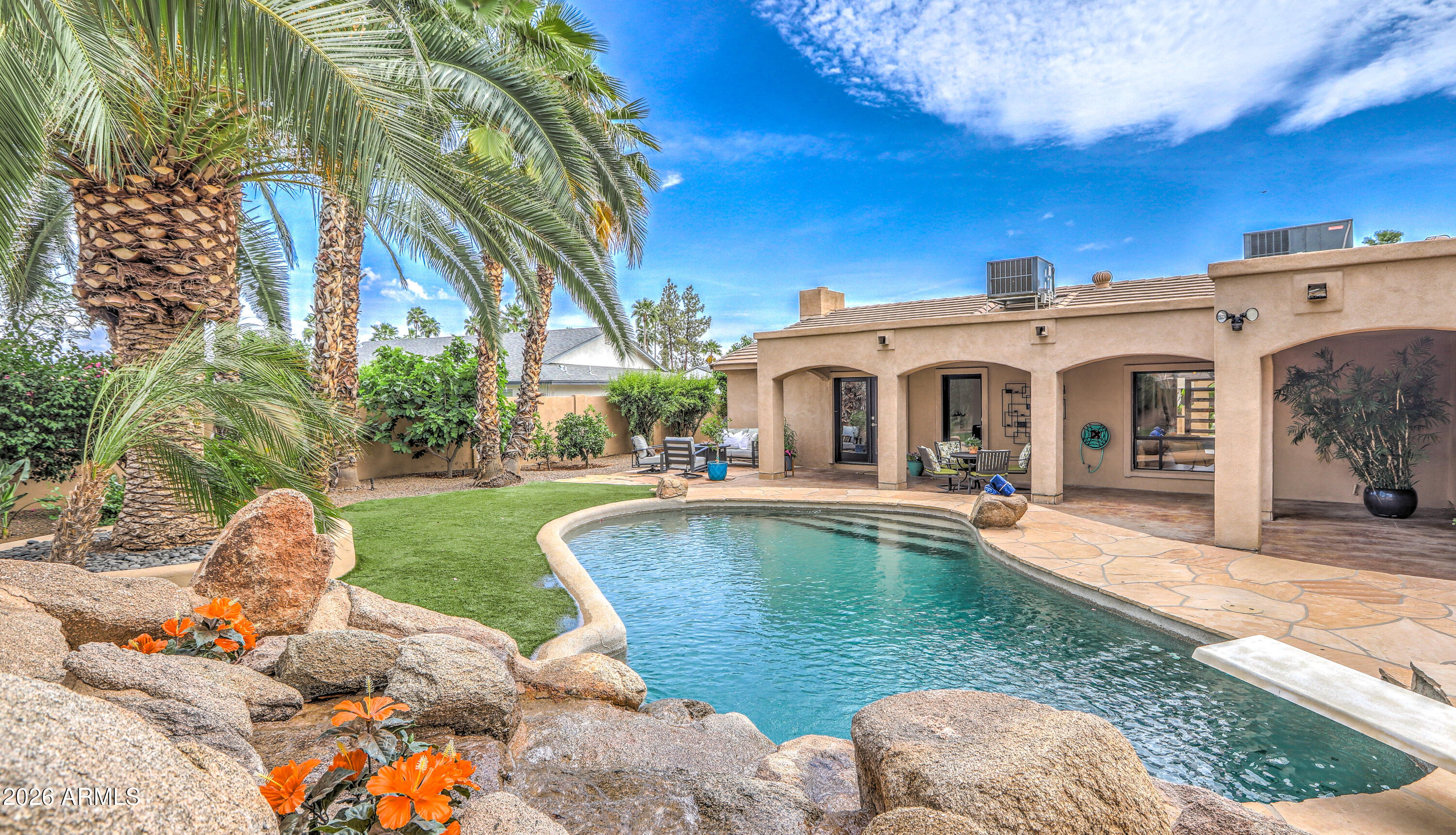 7414 East Corrine Road Scottsdale, AZ 85260 - Photo 18 of 67 a swimming pool with outdoor seating yard and barbeque oven