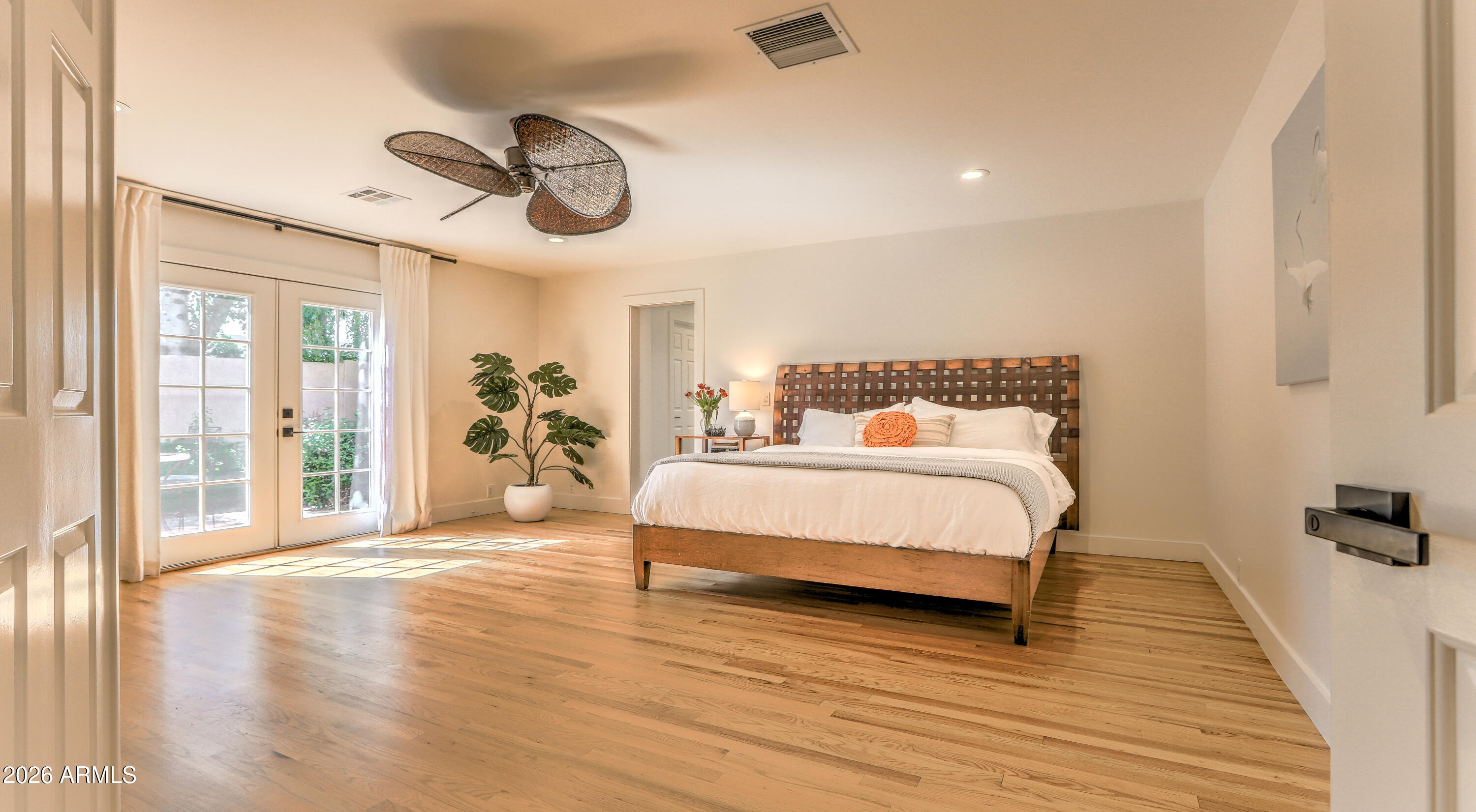7414 East Corrine Road Scottsdale, AZ 85260 - Photo 3 of 67 a bedroom with a bed and wooden floor