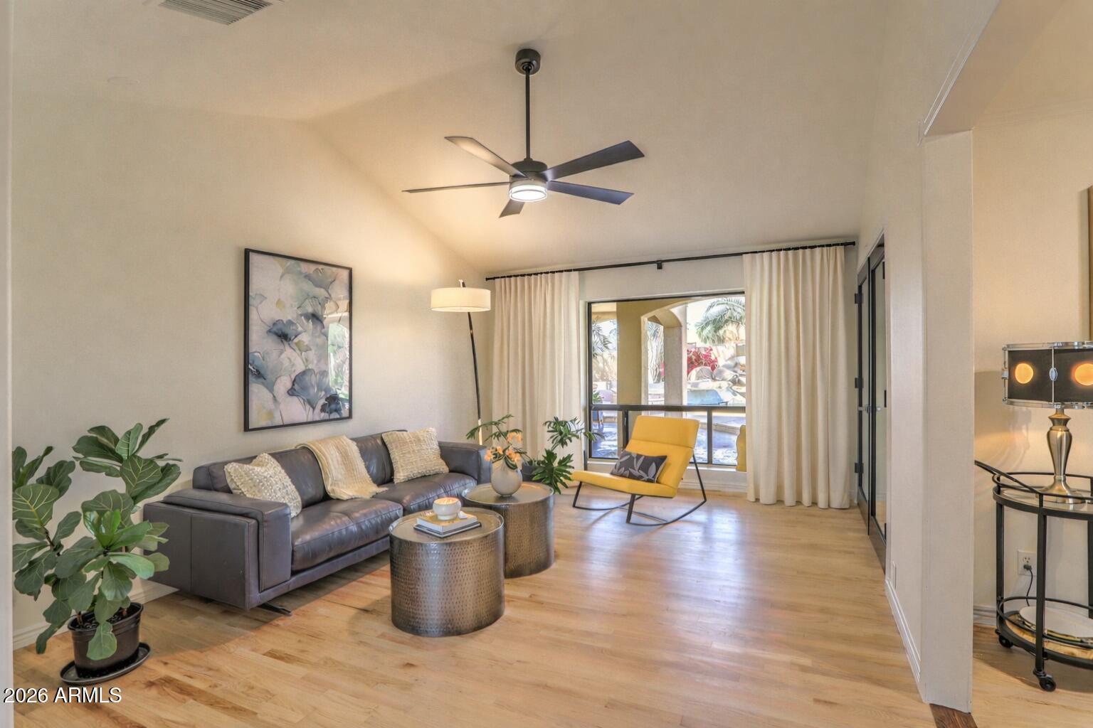 7414 East Corrine Road Scottsdale, AZ 85260 - Photo 36 of 67 a living room with furniture and wooden floor