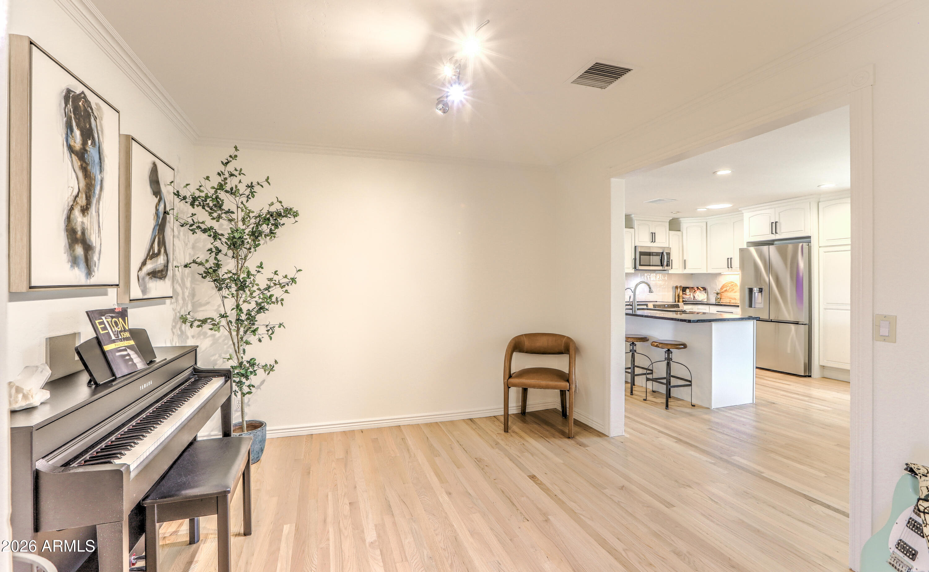7414 East Corrine Road Scottsdale, AZ 85260 - Photo 40 of 67 a kitchen with furniture and wooden floor
