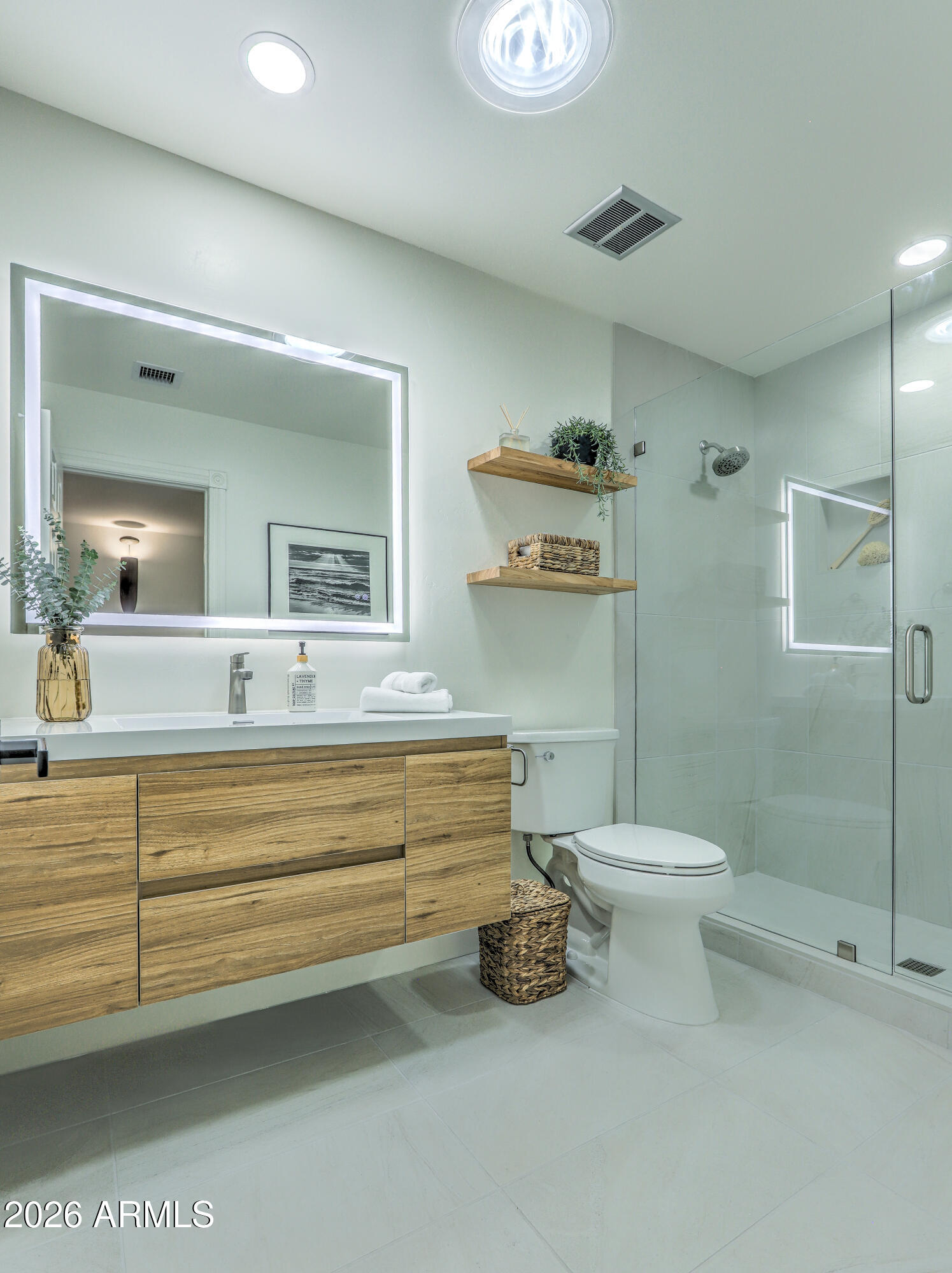 7414 East Corrine Road Scottsdale, AZ 85260 - Photo 47 of 67 a bathroom with a sink a toilet and a mirror