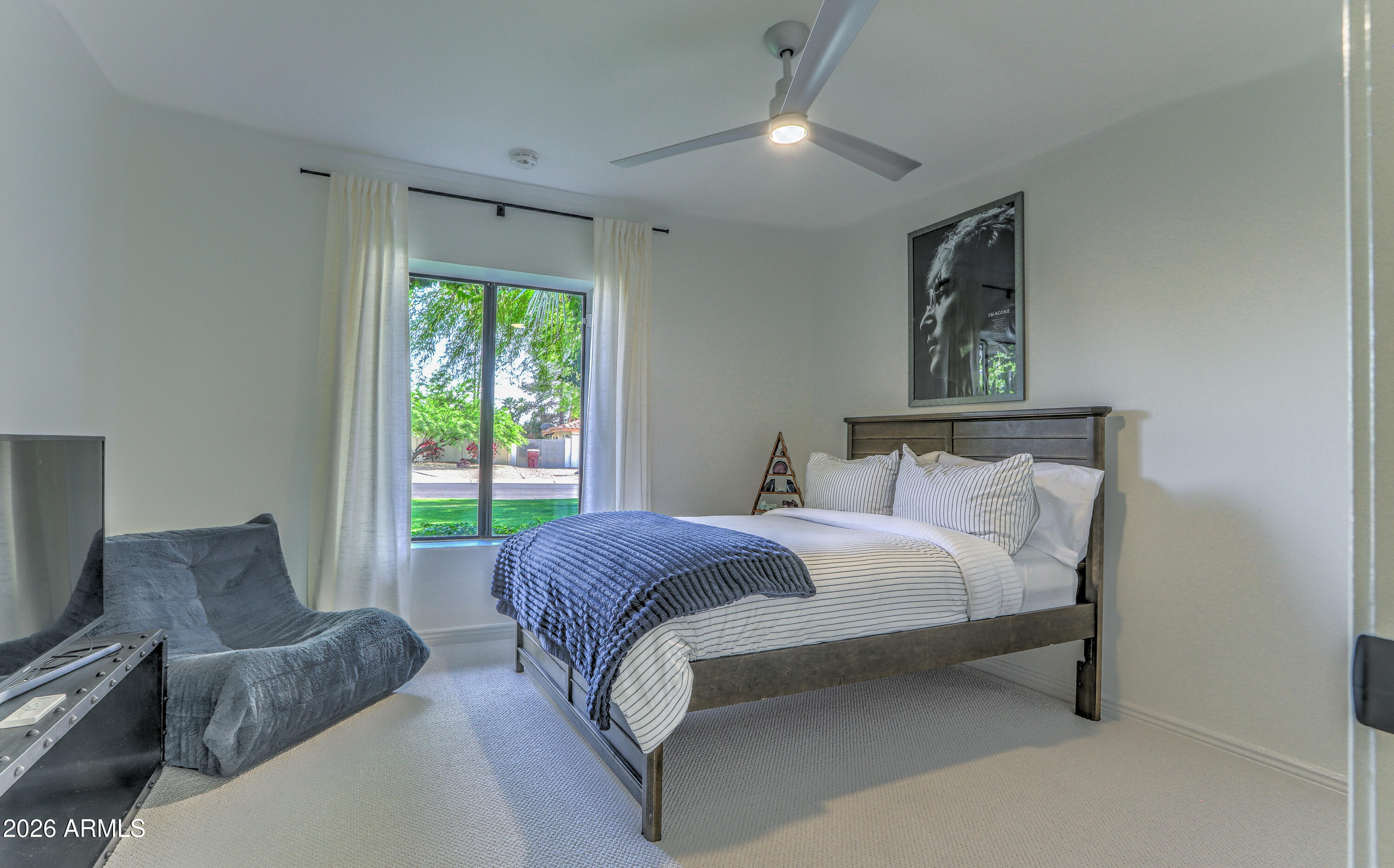 7414 East Corrine Road Scottsdale, AZ 85260 - Photo 50 of 67 a bed room with a bed and a couch