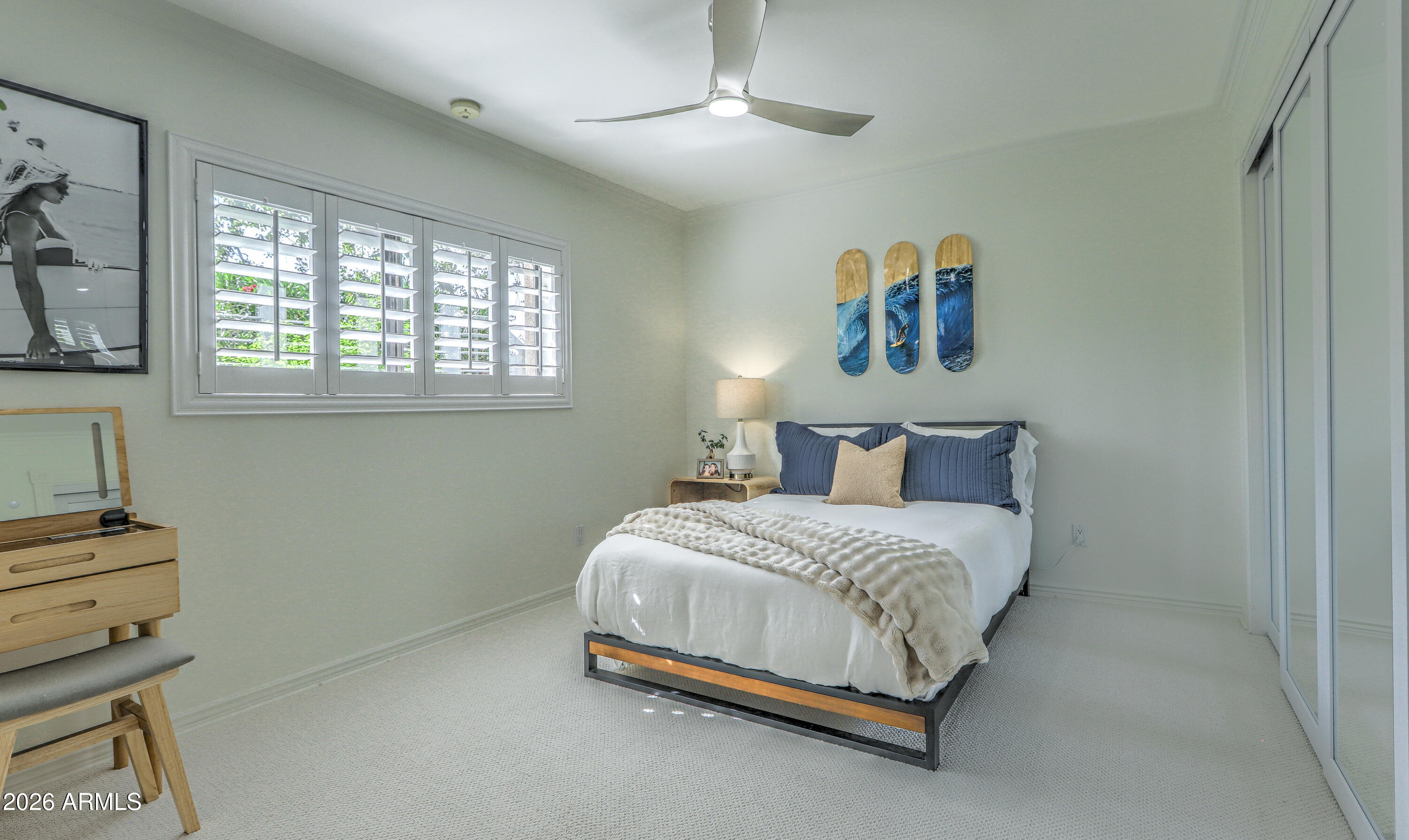 7414 East Corrine Road Scottsdale, AZ 85260 - Photo 51 of 67 a bedroom with a bed and a chandelier