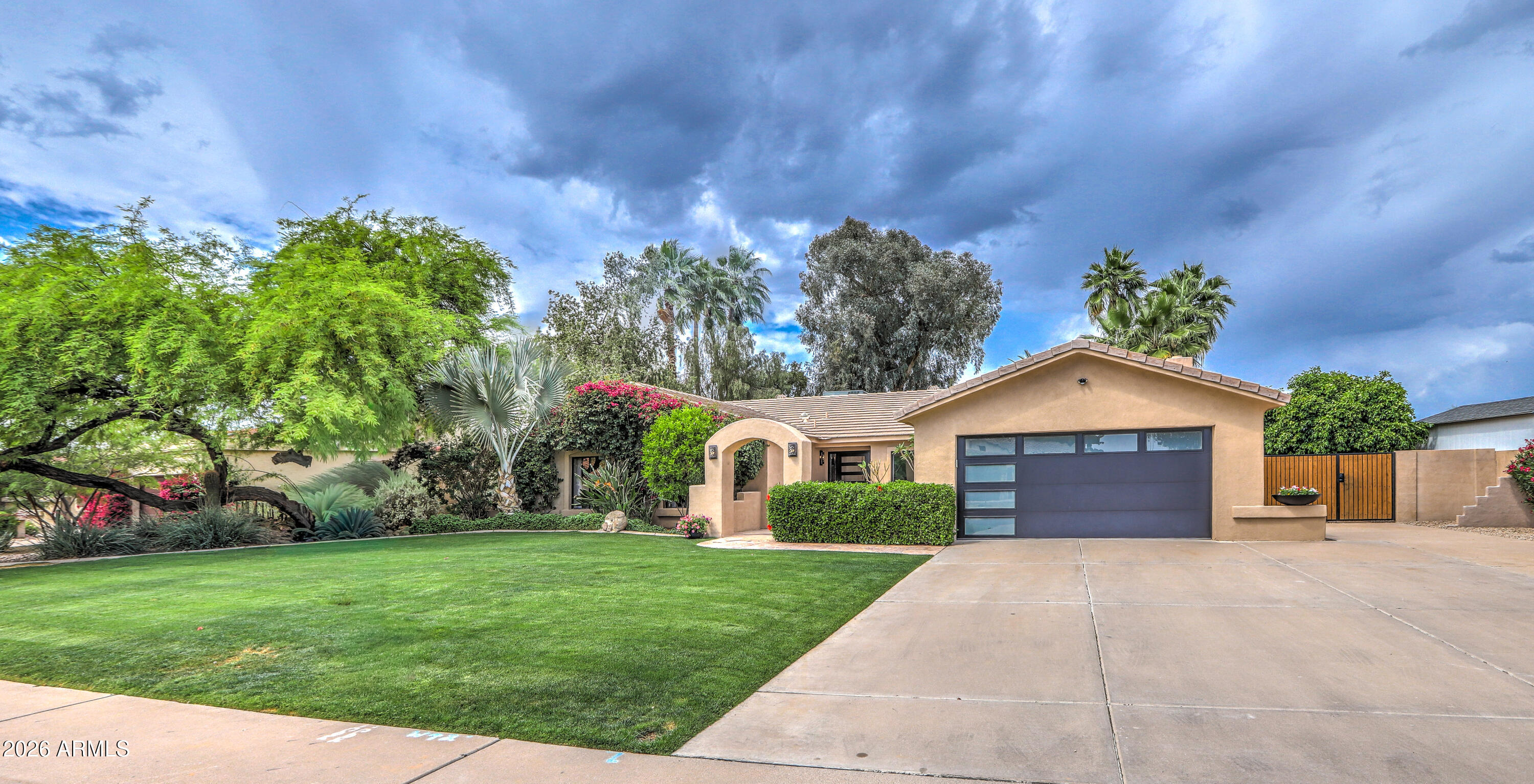 7414 East Corrine Road Scottsdale, AZ 85260 - Photo 61 of 67 a front view of a house with garden