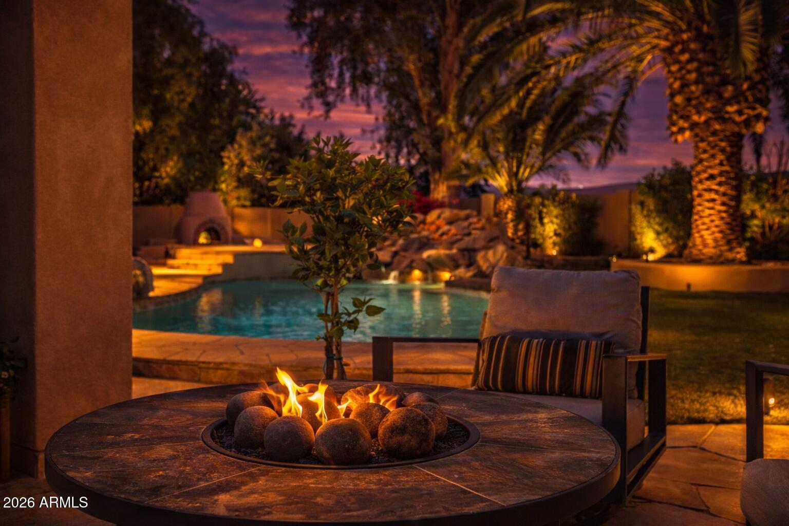 7414 East Corrine Road Scottsdale, AZ 85260 - Photo 63 of 67 a view of a patio with a table and chairs